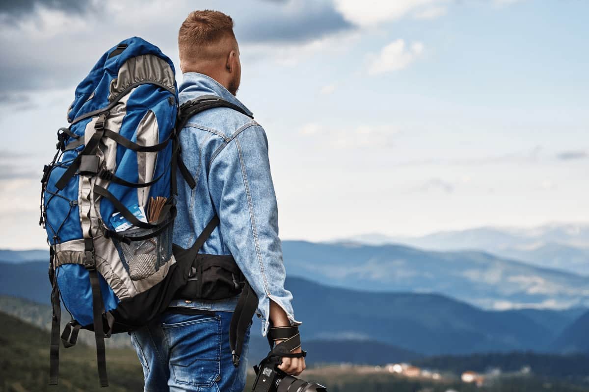 Man carrying camera backpack